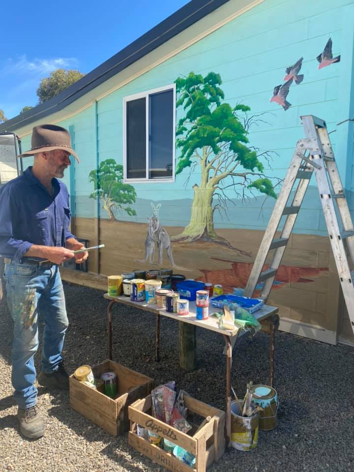 Artist Jim Dunstan painting New Mural on Eudunda Preschool-Kindy Wall