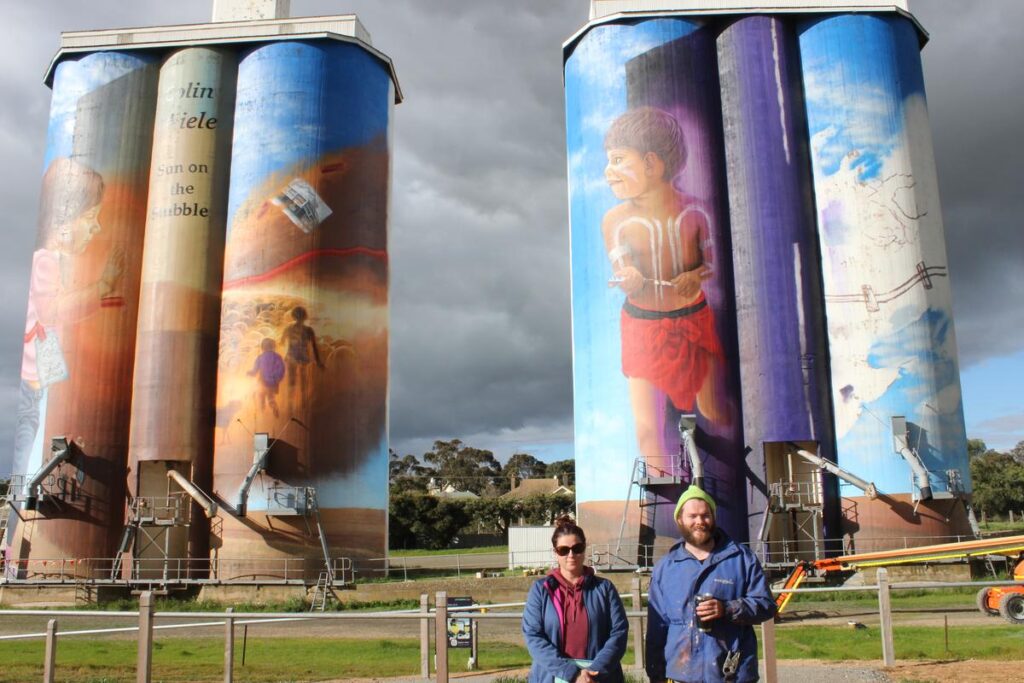 Councillor Debbie Hibbert with Eudunda Silo Artist Sam Brooks taking a brief pause to check his work