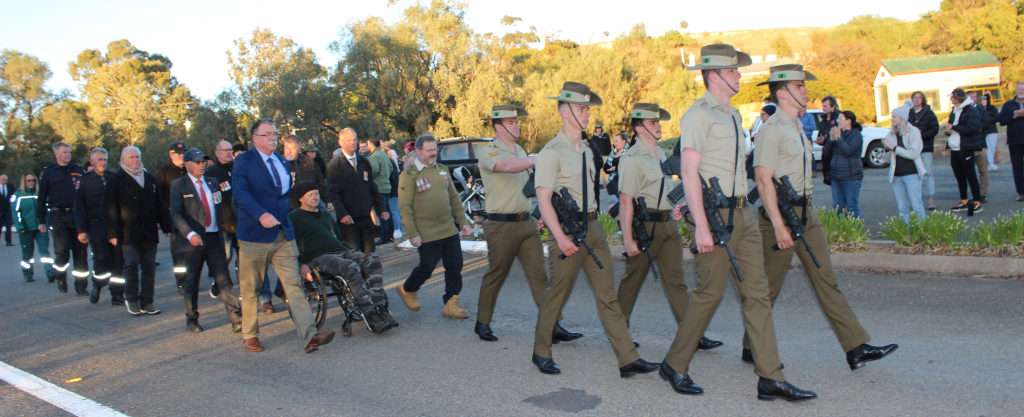 Marching to the Eudunda RSL Rooms the parade is applauded by the bystanders